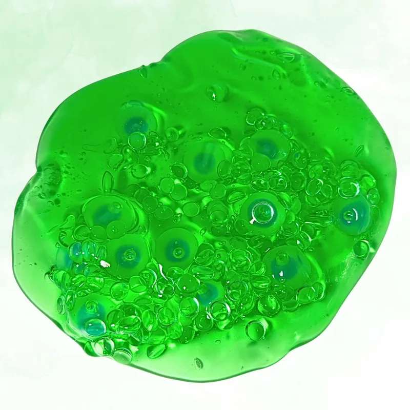 Clear green slime full of round beads and bubbles