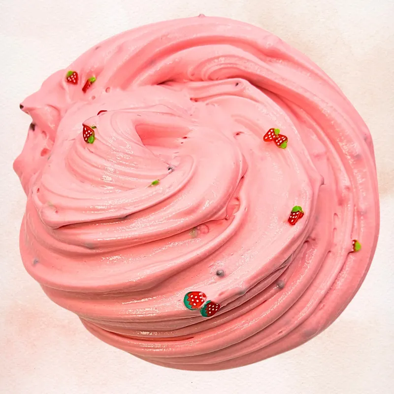 Close-up of the pink slime swirled with tiny strawberry charms
