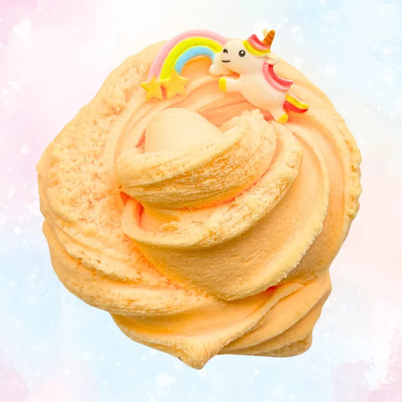 Peach slime swirl with a unicorn and rainbow charm